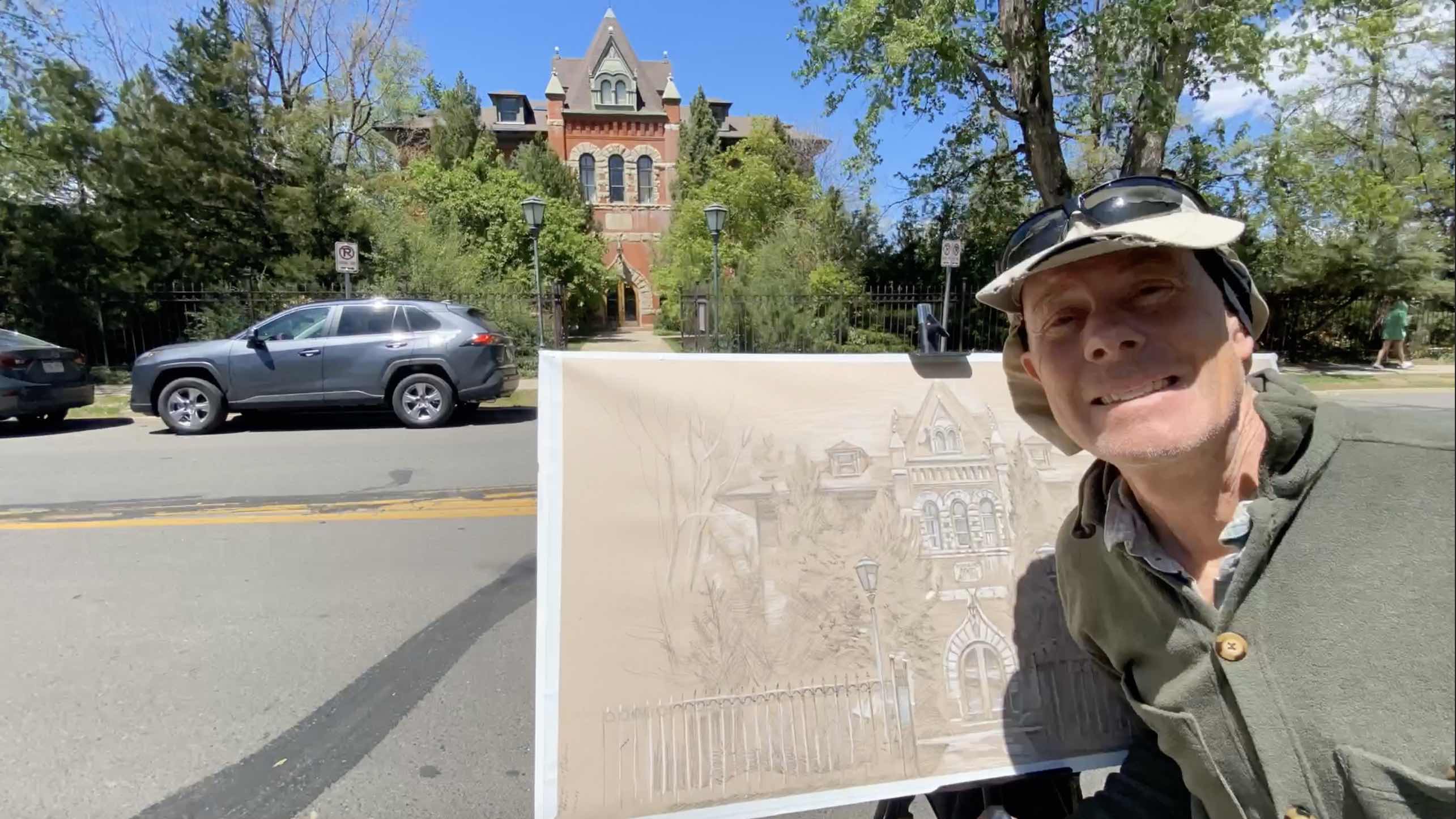 Jonathan Machen posing with plein-air sketch of the Highland City Club in Boulder, 5-13-22